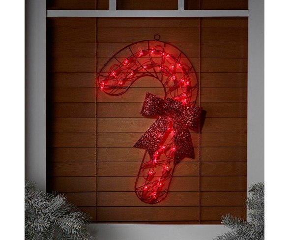 Impact Innovations 19" Lighted Red Candy Cane with Bow Christmas Window or Wall Silhouette Decoration
