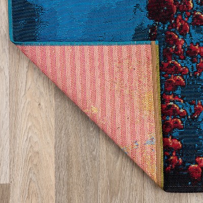 Galactic Wonder Blue and Red Synthetic Area Rug 5' x 7'