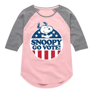 Girls' - Peanuts - Snoopy Go Vote Shirt Tail Raglan Graphic T-shirt - 1 of 4