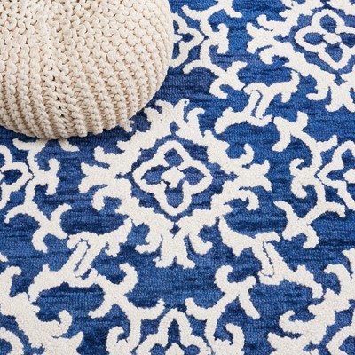 Ivory and Navy Hand Tufted Wool 4' x 6' Area Rug