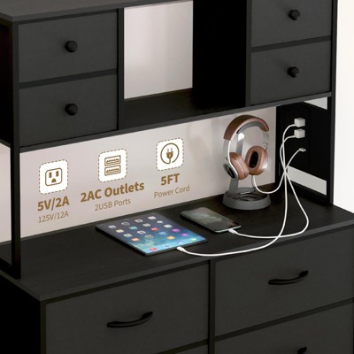 Rear/side view of desk area showing outlets and USB ports