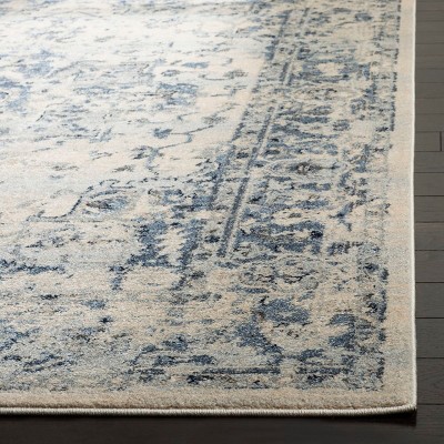 Ivory and Navy 8' x 10' Synthetic Oriental Area Rug