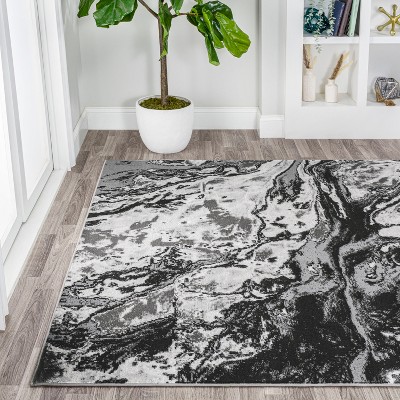 Black and Ivory Abstract Synthetic 4' x 6' Area Rug