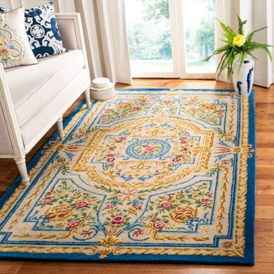 Handmade Blue and Ivory Wool 4' x 6' Tufted Area Rug