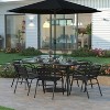 Emma and Oliver 7-Piece Patio Dining Table and Chairs Set with 60" Tempered Glass Top Table, 6 Stack Triple Slat Chairs in Black - 2 of 4