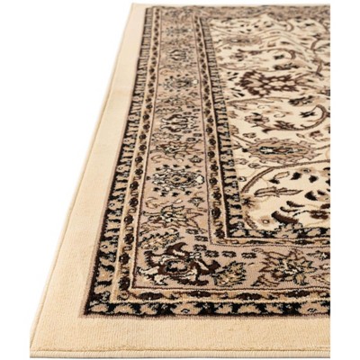 Ivory and Tan 4' x 6' Stain-Resistant Synthetic Area Rug