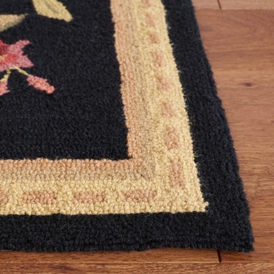 Handmade Black Floral Wool Oval Tufted Rug