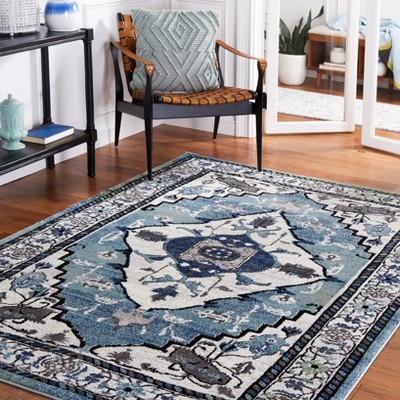 Blue and Ivory Synthetic Persian Area Rug, 5'3" x 7'6"