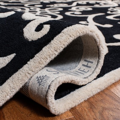 Handmade Black and Ivory Wool Viscose Tufted Area Rug