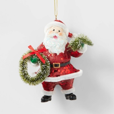 Sparkling Santa Suit Holding Tree and Wreath Christmas Tree Ornament - Wondershop™