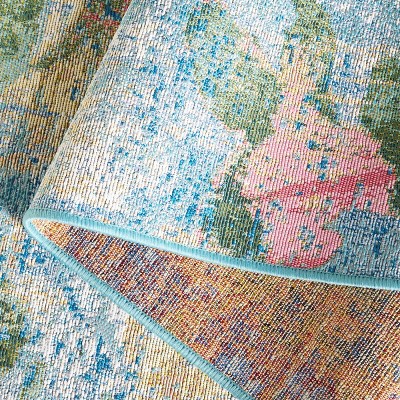 Reversible Light Blue Synthetic 4' x 6' Stain-Resistant Area Rug