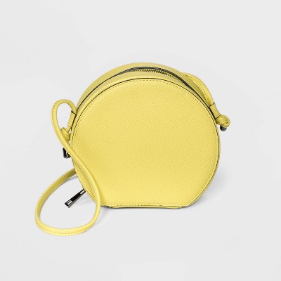 yellow round crossbody bag