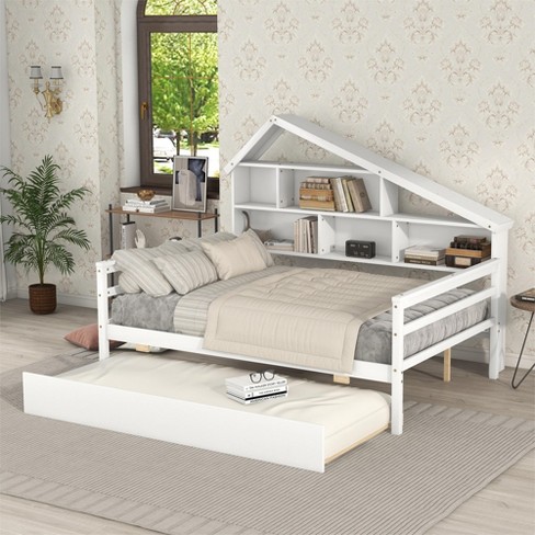 White full size bed with outlet trundle