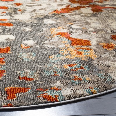 9' Round Grey and Orange Geometric Synthetic Area Rug