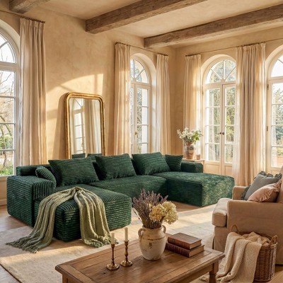 Dark green modular sectional sofa with beige seating area