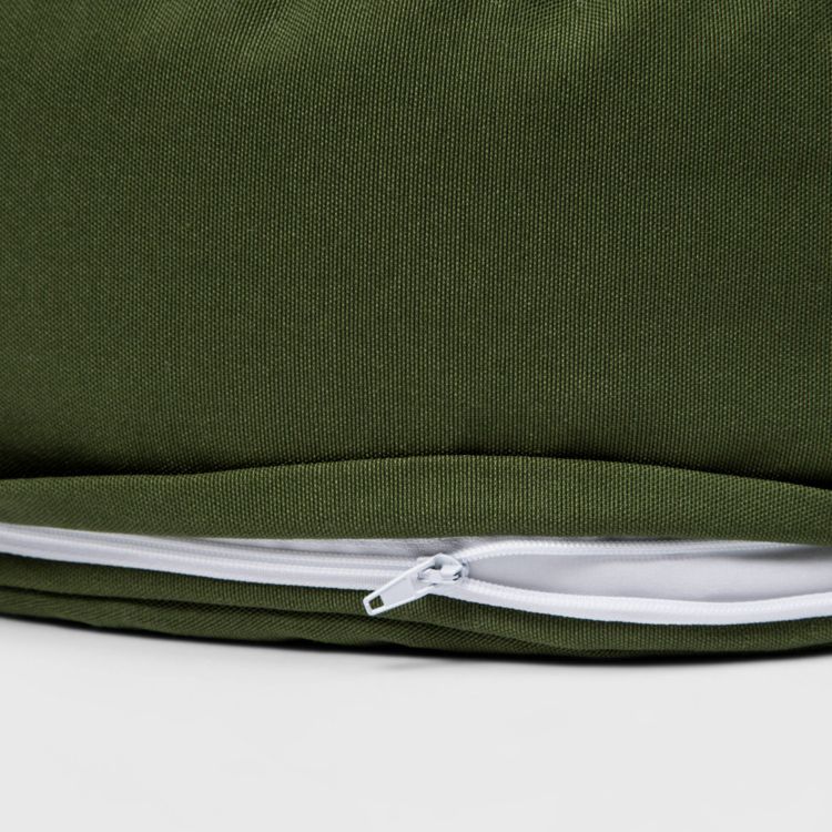 A green colored pillow with a visible white zipper on the side.