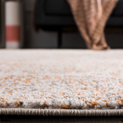 Ivory and Orange Synthetic Stain-Resistant Area Rug 3' x 5'