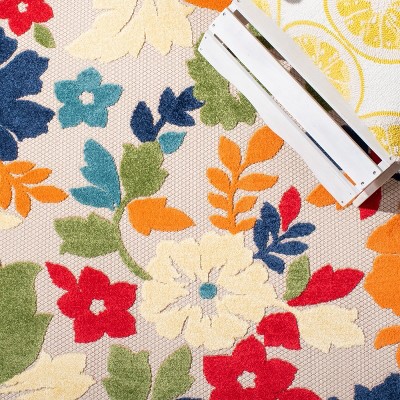 Ivory and Orange Floral Synthetic Outdoor Rug, 26" x 9'