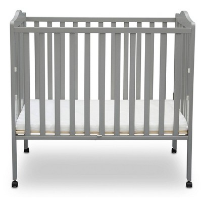 Photo 1 of Delta Children Folding Portable Crib with Mattress Grey