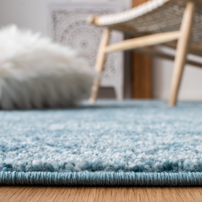Turquoise Blue Synthetic Rectangular Boho Area Rug 5'3" x 7'6"