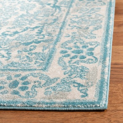 Ivory and Light Blue Synthetic Round Area Rug, 4' x 6'