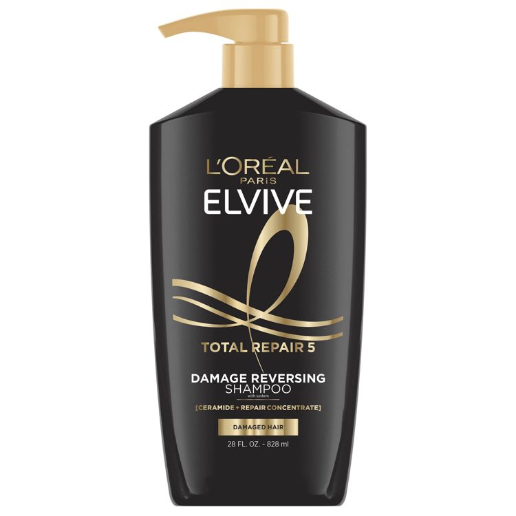 Black colored bottle of L'Oreal Paris Elvive Total Repair 5 Damage Reversing Shampoo with a gold pump, labeled 28 fl. oz. (828 ml).