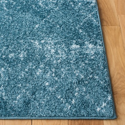 Turquoise and Blue Synthetic 4' x 6' Reversible Area Rug