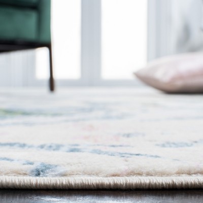 Blue and Green Floral Synthetic Area Rug 5'3" x 7'7"