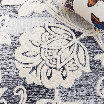 Handmade Black and Ivory Floral Wool Area Rug, 5' x 8'