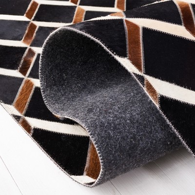 Handmade Black Geometric Wool and Cowhide Rug, 4' x 6'