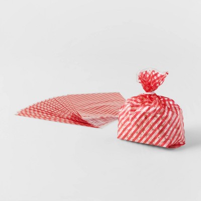 red and white striped gift bags