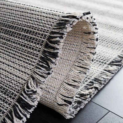 Ivory and Black Flat Woven Synthetic 5' x 7' Area Rug
