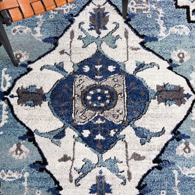 Blue and Ivory Synthetic Persian Area Rug, 5'3" x 7'6"