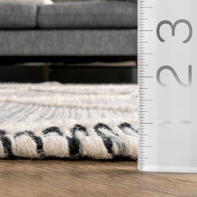 Handmade Ivory Wool 5'x8' Braided Tassel Area Rug