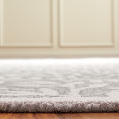 Grey and Ivory 4' x 6' Handmade Tufted Wool Area Rug