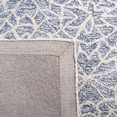 Ivory and Blue Handmade Wool Tufted 6' x 9' Abstract Rug