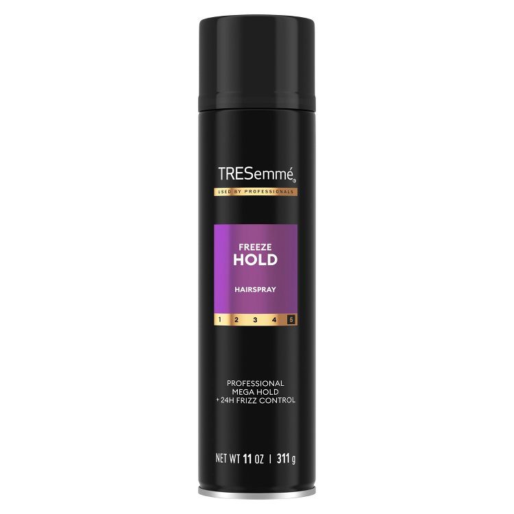 Black colored hairspray can with "TRESemmé Freeze Hold" label and "Professional Mega Hold + 24H Frizz Control" text, containing 11 oz / 311 g.
