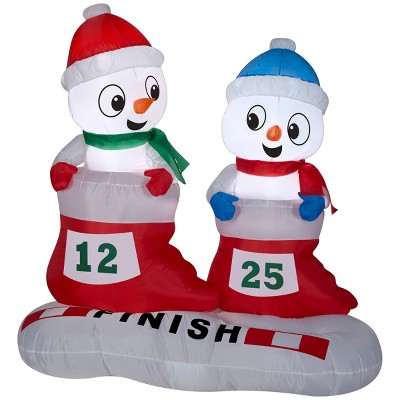 Gemmy Christmas Airblown Inflatable Snowman in Stocking Races Scene, 4 ft Tall, Multicolored