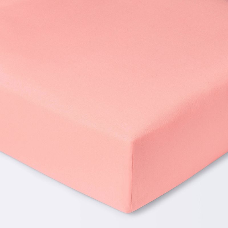 Crib Fitted Sheet Solid - Cloud Island&#8482; - Coral, 1 of 6
