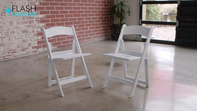 Flash Furniture 2 Pack HERCULES Series 1000 lb. Capacity White Resin Folding Chair with Slatted Seat, 2 of 13, play video
