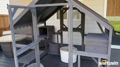Large Gray Wooden Outdoor Cat House with Wire Mesh