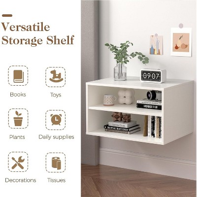 Wall-mounted white cube storage shelf shown with plant and clock decoration