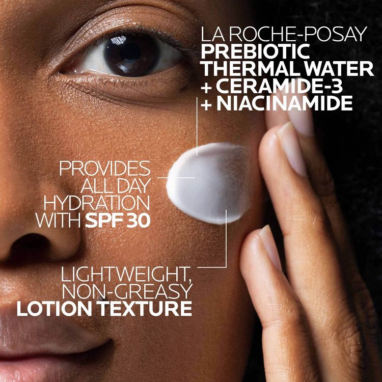 A close-up of a person applying white colored moisturizer with text highlighting ingredients like prebiotic thermal water, ceramide-3, niacinamide, and SPF 30 for all-day hydration.