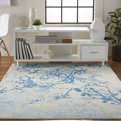 Ivory and Blue Abstract Synthetic 4' x 6' Easy-Care Area Rug
