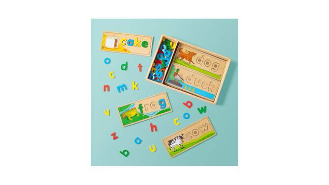 Melissa &#38; Doug See &#38; Spell Wooden Educational Toy With 8 Double-Sided Spelling Boards and 64 Letters, 2 of 18, play video