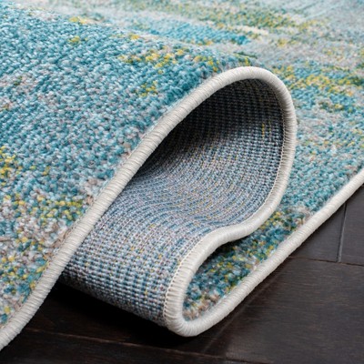 Light Blue and Green Abstract Distressed 6' x 9' Rug