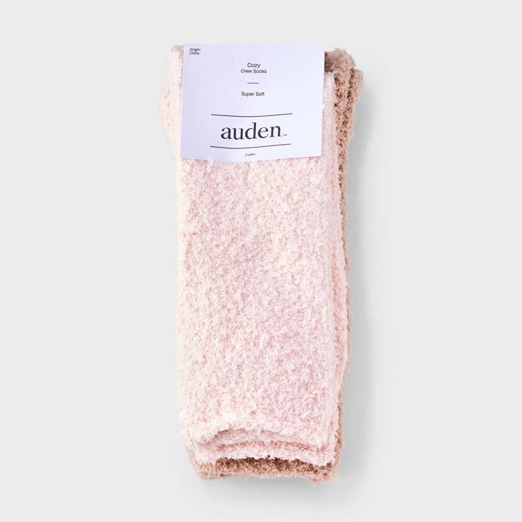 Two pairs of fluffy, light pink colored crew socks with a label reading "Cozy Crew Socks Super Soft auden."