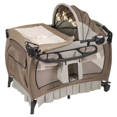 Photo 1 of Baby Trend Deluxe Home Nursery Padded Play and Nap Center with Music, Flip Away Changing Table, Full Bassinet, and Travel Bag, Havenwood
