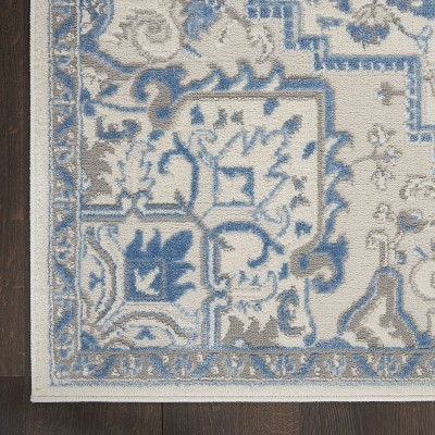 Ivory Blue Floral Synthetic 5' x 7' Rectangular Rug