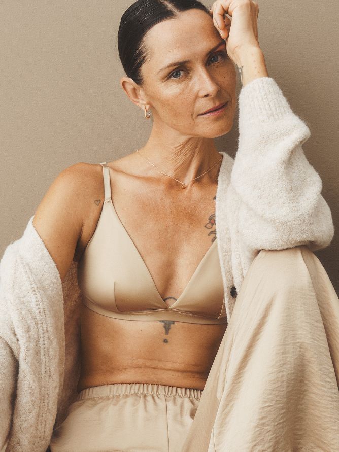 Start at the base with a silky smooth bra and matching satiny comfy pants on the bottom. Layer a super-soft sweater on top to complete the look and stay warm.